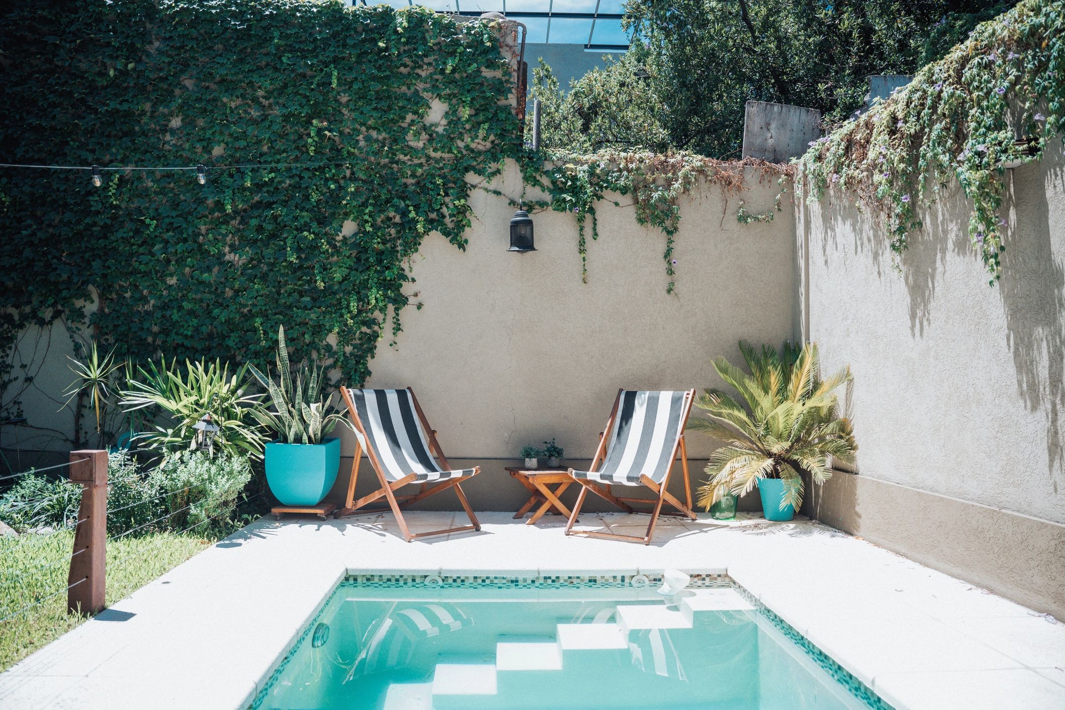 Backyard pool with loungers—customer testimonial background image