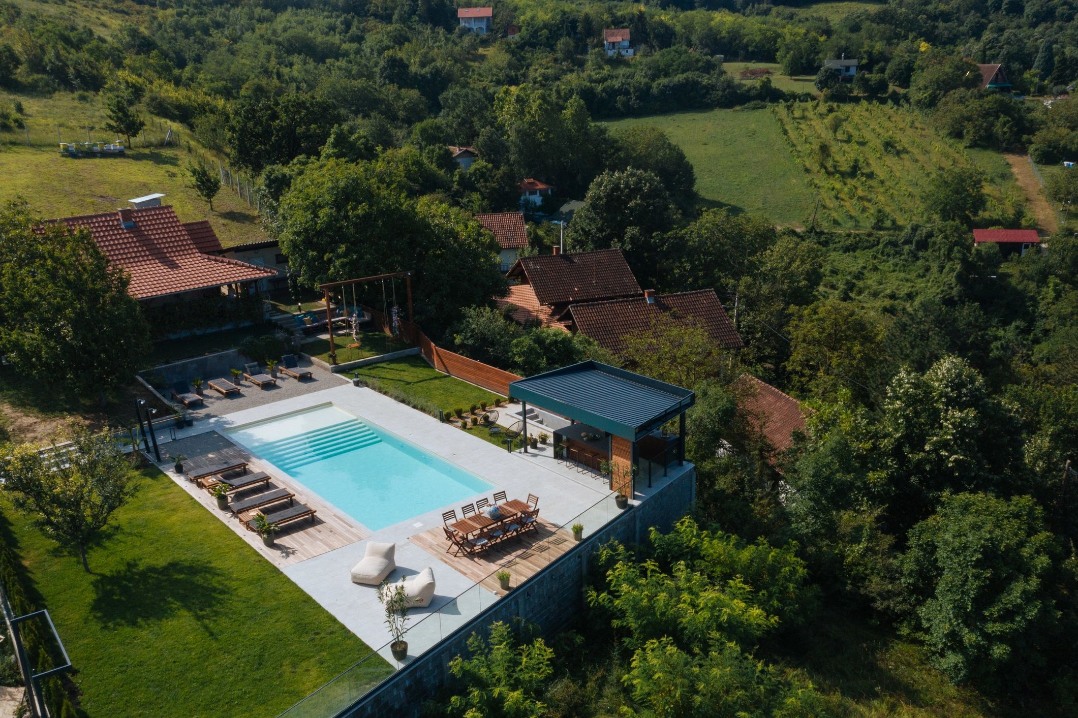 Aerial view of a home with a swimming pool