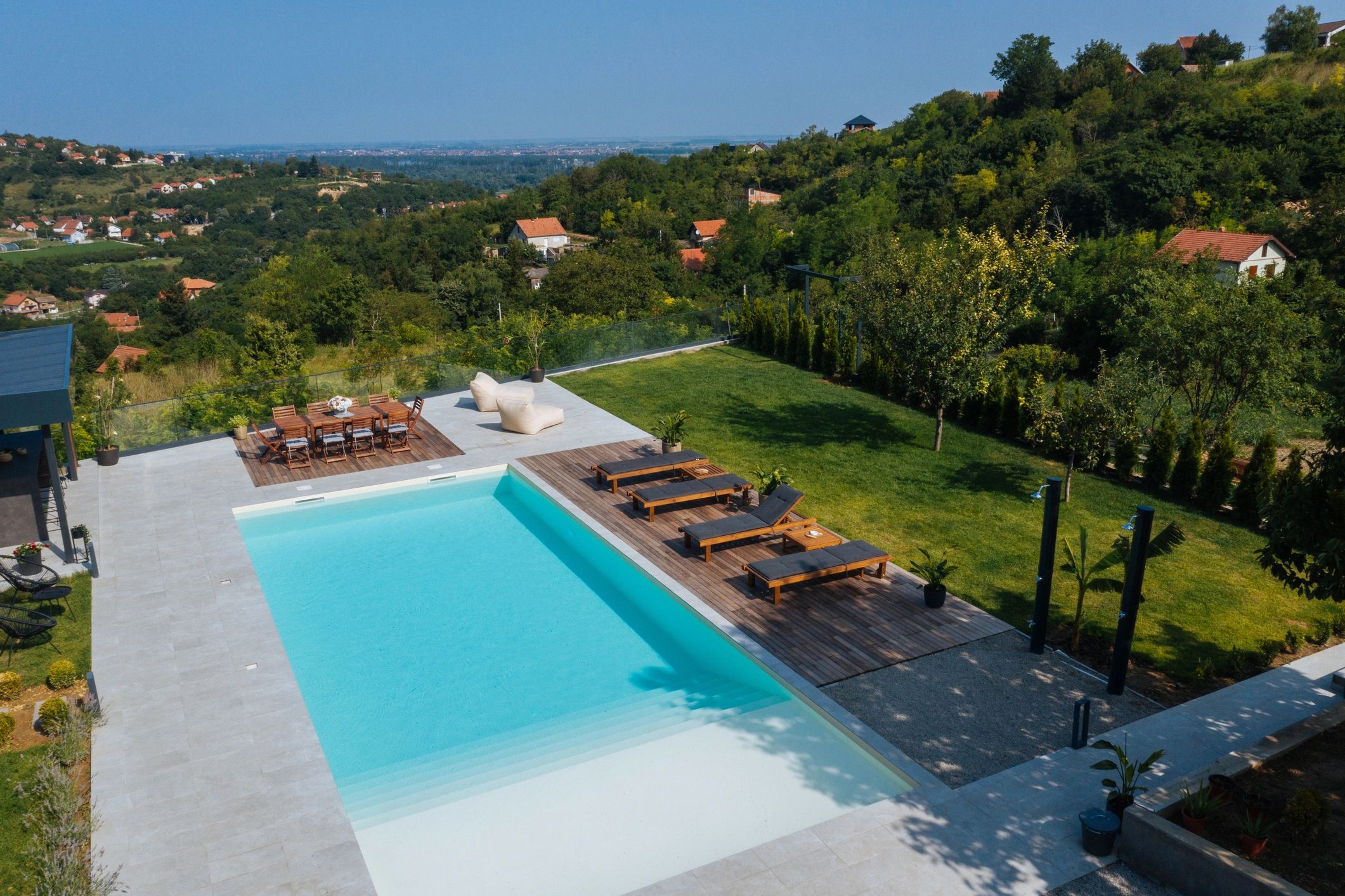 Outdoor pool area with cover-ready modern design