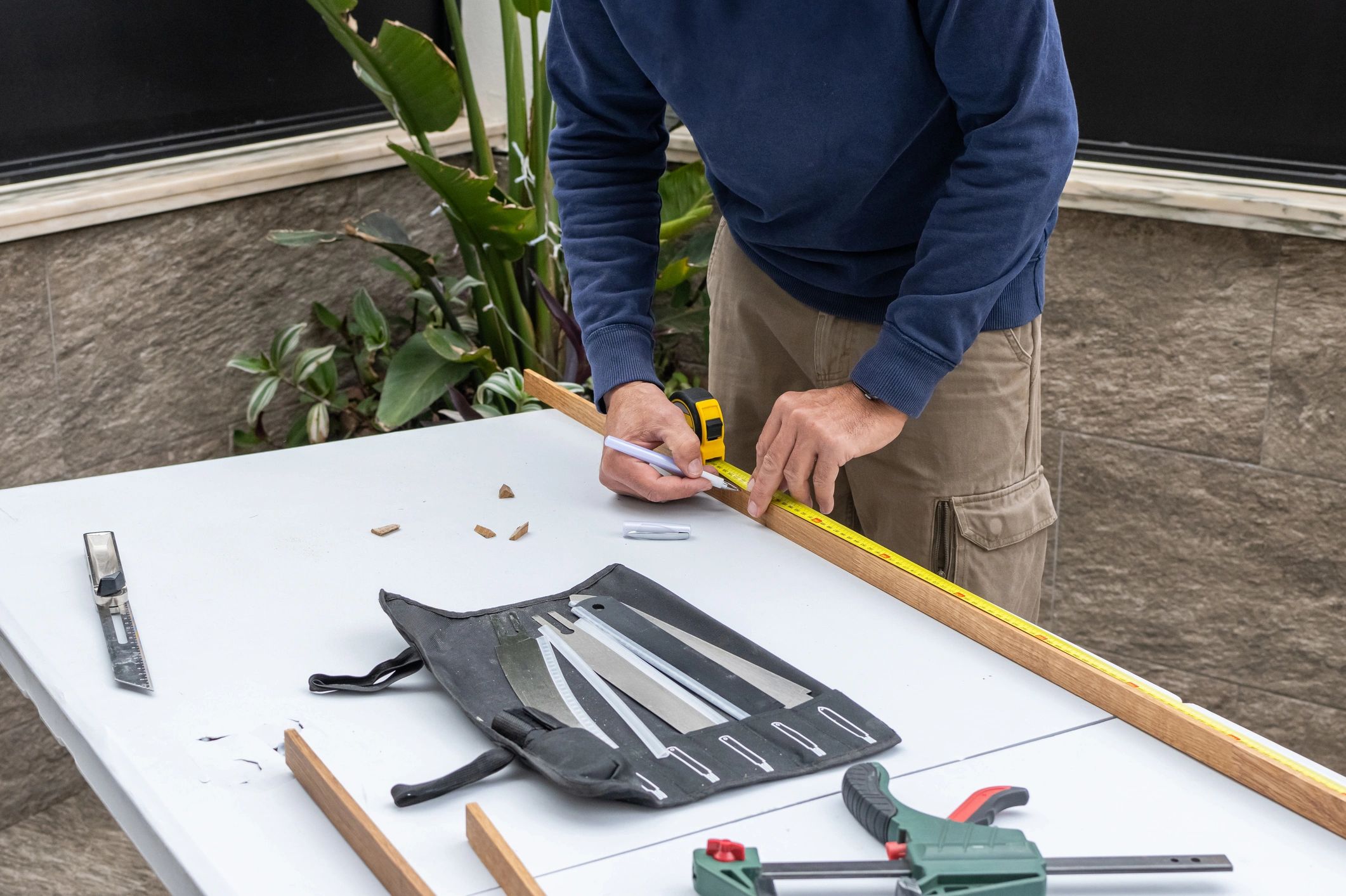 Person using a tape measure for precise measurements